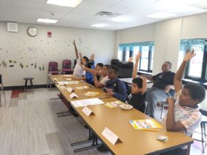 Project Future participants raising hands